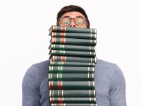 Student with a pile of books