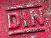 DIN writing as metal embossing