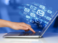 Laptop with email icons