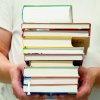 Student with a pile of books