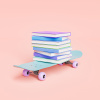 Skateboard with pile of books