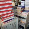 Piles of books on transport carts