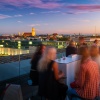 Sunset on the roof terrace with a view of the Frauenkirche in Munich