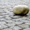 Stumbling stone on pavement