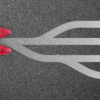 A pair of shoes in front of branching directional arrows