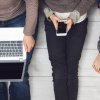 Man, woman and child with mobile devices