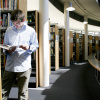 Student between book shelves