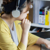 Student with headset and laptop while studying