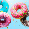 bunte Donuts fliegen durch die Luft