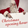 Santa Claus with a sign indicating Christmas opening hours.